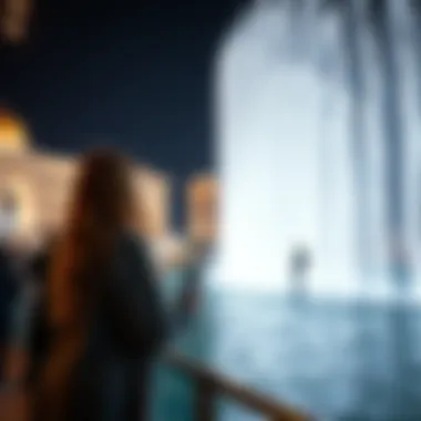 Visitor Experience at the Dubai Fountain Show Visitors enjoying the spectacular display from a nearby vantage point